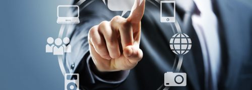 Businessman pressing virtual icons